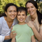 lesbian-couple-with-their-son-spending-time-together-outdoors